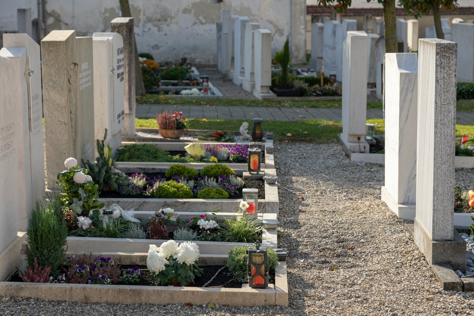  Graves in a cemetery on All Saints’ Day Photo by  Norbert Staudt  on  Unsplash    